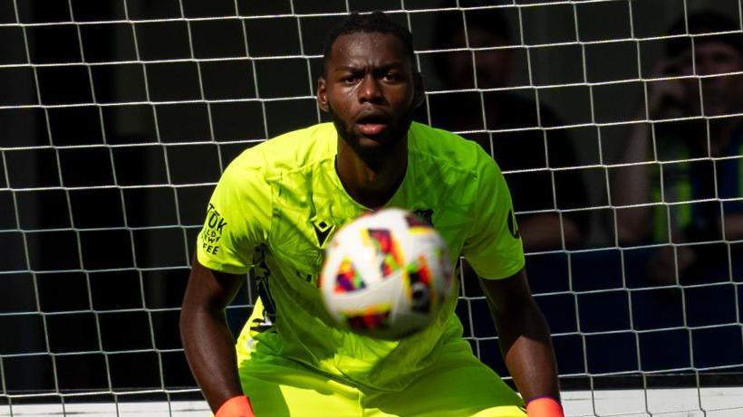 Arthur Okonkwo in action for Wrexham