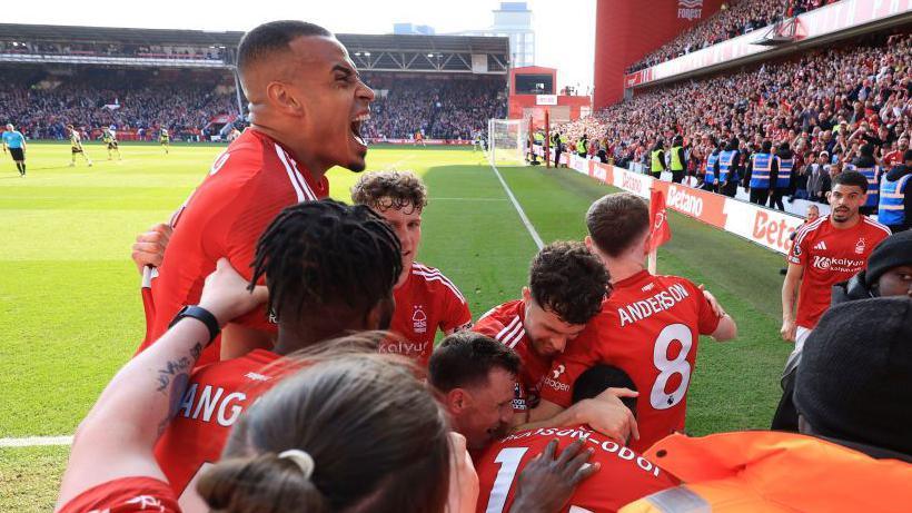 Nottingham Forest players celebrate after opening the scoring against Manchester City at the City Ground