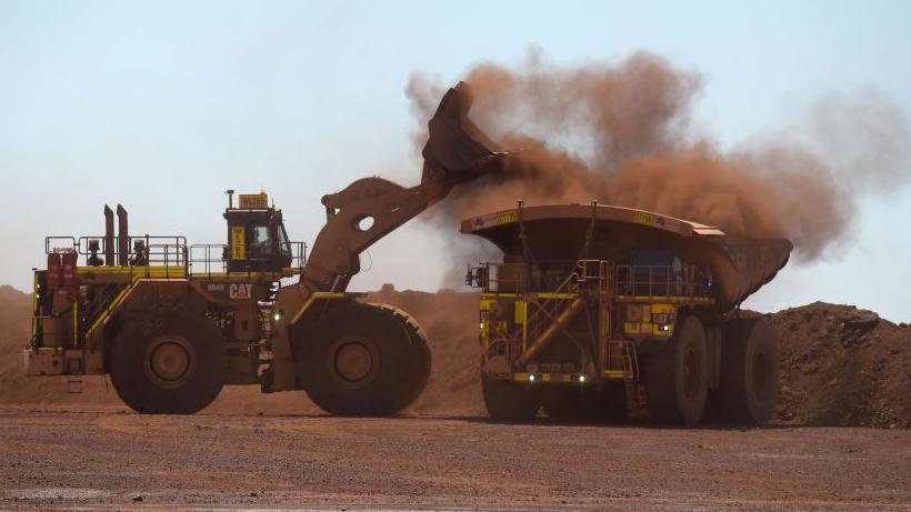 Iron ore being loaded at a mine in Western Australia