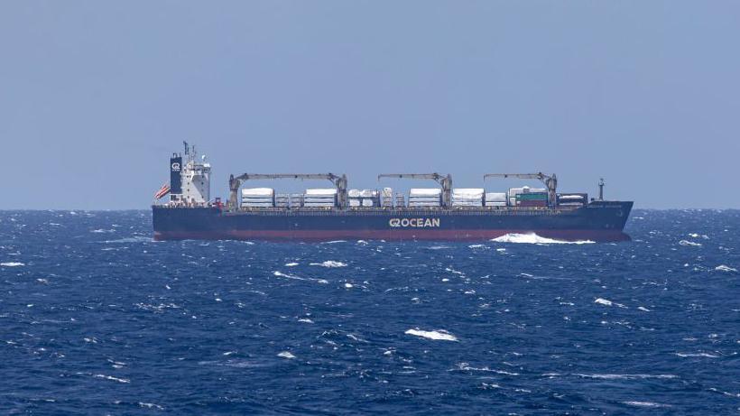 File photo showing a merchant ship seen from the USS Dwight D Eisenhower aircraft carrier during operations in the southern Red Sea, on 20 March 2024