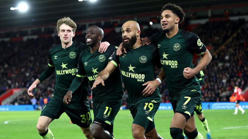 Brentford players Mads Roerslev, Yoane Wissa, Bryan Mbeumo and Kevin Schade celebrate Mbeumo's second goal against Southampton.