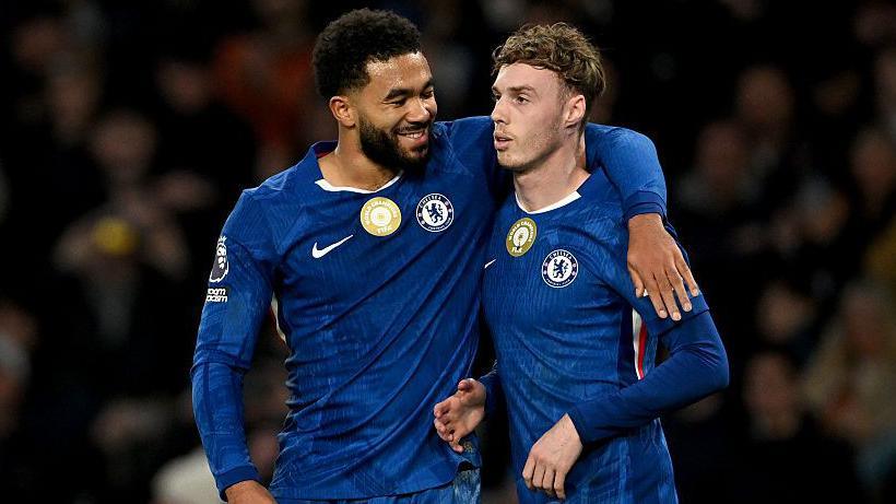 Reece James with his arm round Cole Palmer during a game