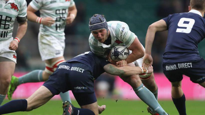 Koster being tackled during the Oxford University vs Cambridge University Mens Varsity match at Twickenham Stadium in 2017