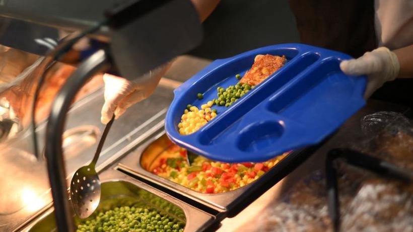 Food being served in a school canteen