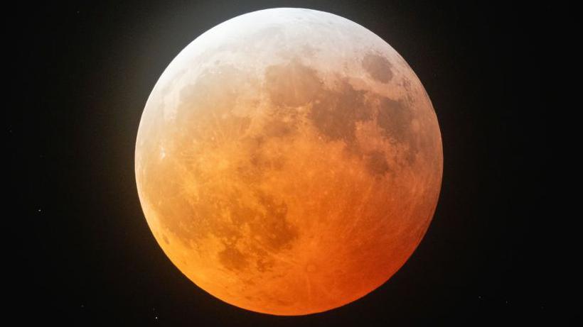 Orange-coloured full moon as seen in Austin, Texas in the United State.