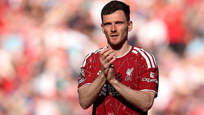 Andy Robertson applauds during his final appearance for Liverpool at Anfield