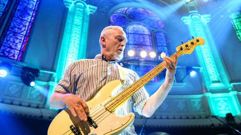 Horace Panter performing on his bass guitar