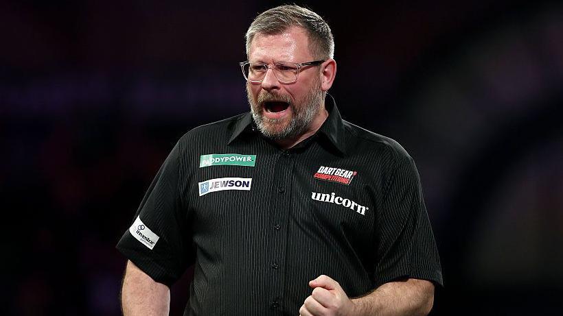 James Wade celebrates 