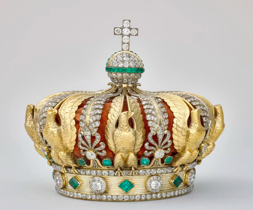 A gold crown adorned with diamonds, green emeralds and eagles moulded from gold which was taken from the Louvre Museum