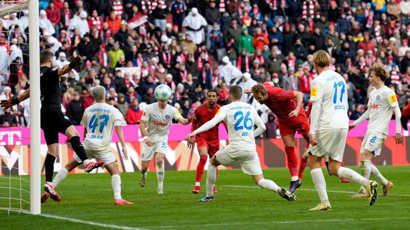 Harry Kane scores against Holstein Kiel