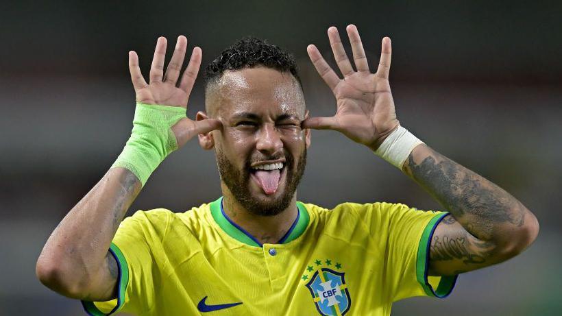 Neymar sticking his tongue out while playing for Brazil