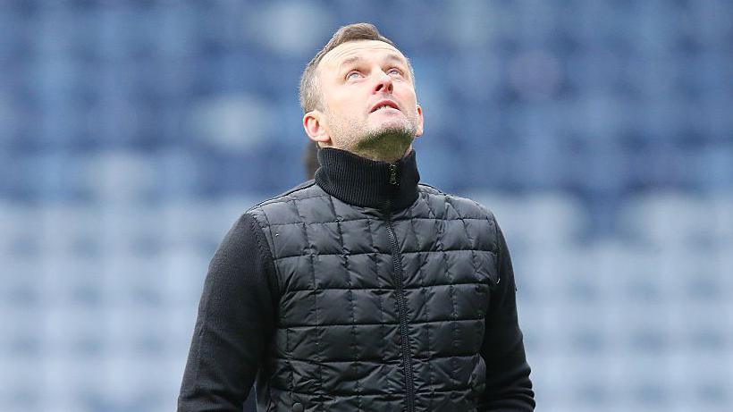 Nathan Jones looks at the sky