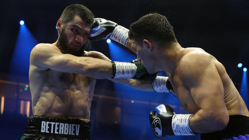 Artur Beterbiev is punched by Dmitry Bivol