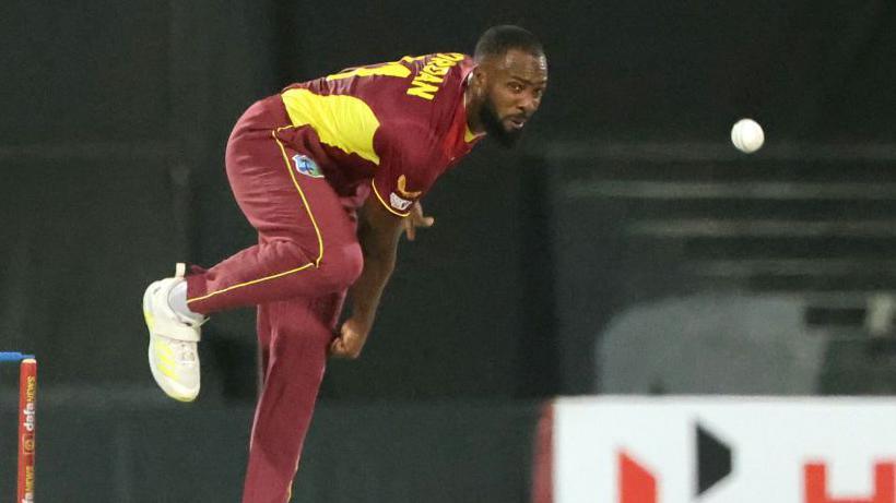 Akeem Jordan bowling for West Indies