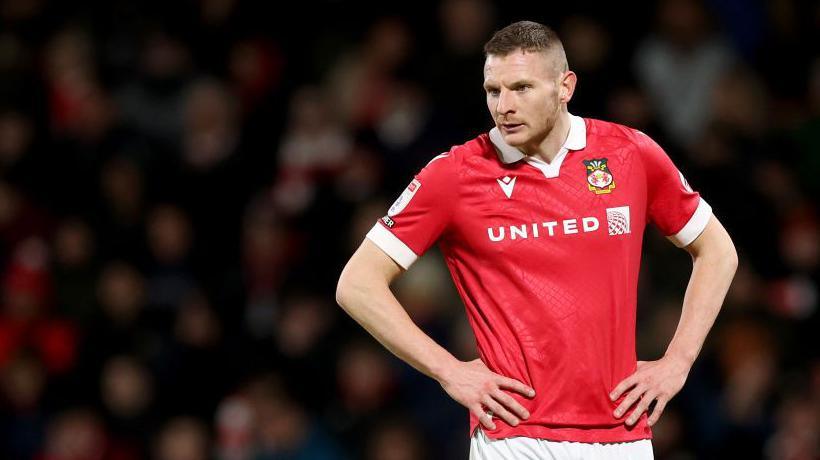 Paul Mullin looks on during a Wrexham game