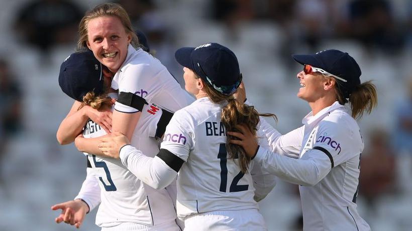 Lauren Filer and England celebrate the wicket of Ellyse Perry during the 2023 Ashes 