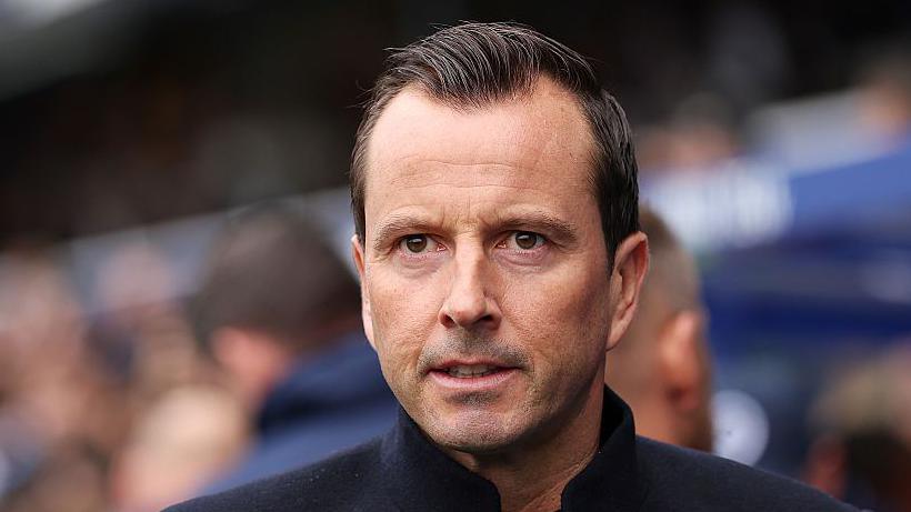 QPR head coach Julien Stephan watches from the touchline.