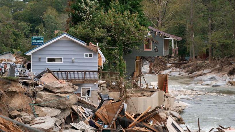 Destroyed houses and buildings along the Broad River in the aftermath of Hurricane Helene in Bat Cave, North Carolina