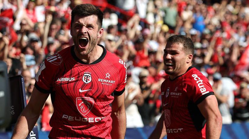 Blair Kinghorn and Antoine Dupont celebrate during Toulouse's semi-final win over Harlequins