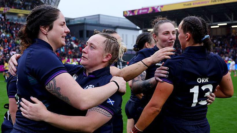 Scotland players embrace after defeat by England in Bristol