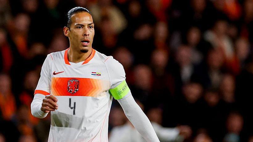 Virgil van Dijk in a white Netherlands kit