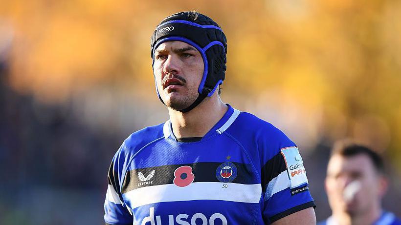 Quinn Roux standing on the pitch with his arms at the side during a match for Bath