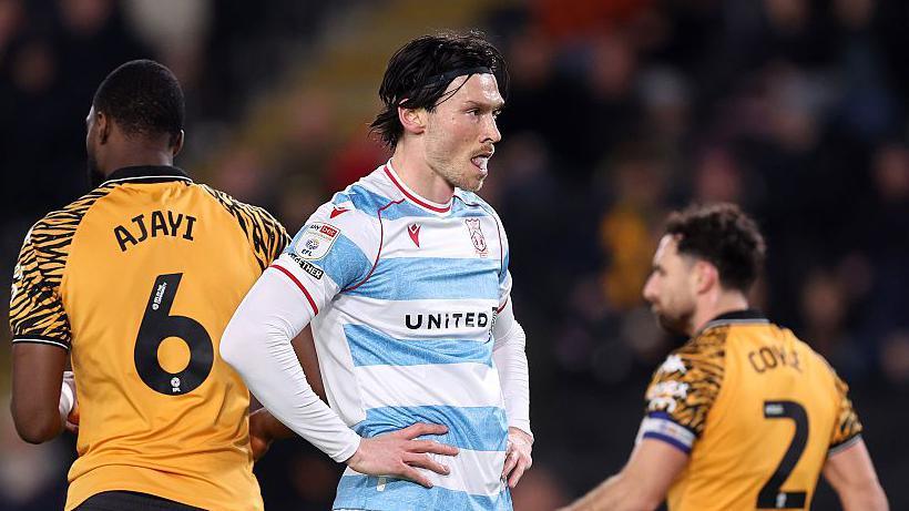 Wrexham striker Kieffer Moore looks dejected