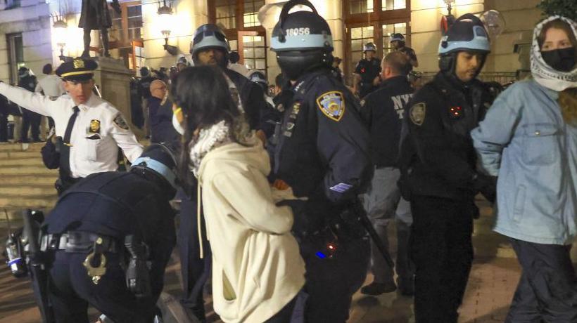 New York Police Department officers detain pro-Palestinian demonstrators at Columbia University  in New York on April 30, 2024