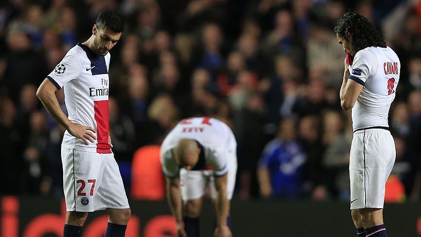 Paris Saint-Germain players look despondent after a late goal by Chelsea in the Champions League in 2014