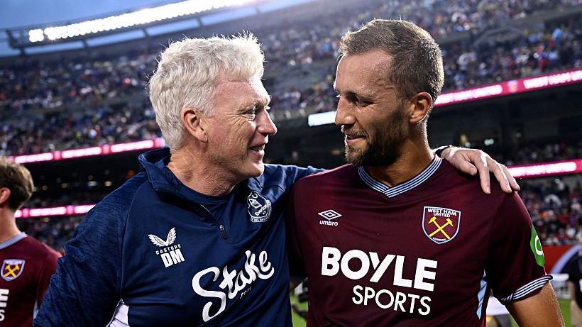 Everton manager David Moyes (left) with West Ham midfielder Tomas Soucek