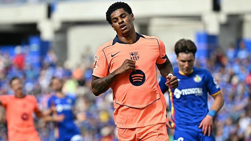 Marcus Rashford celebrates getting the second goal of game