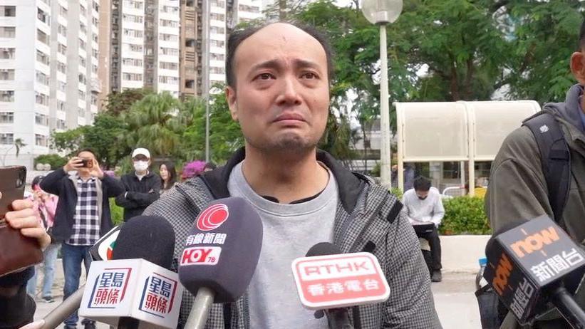 Mr Chung, in a grey windbreaker, was devastated when interviewed by media