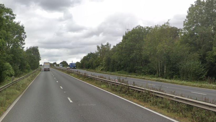 A standard dual carriageway with a metal central reservation