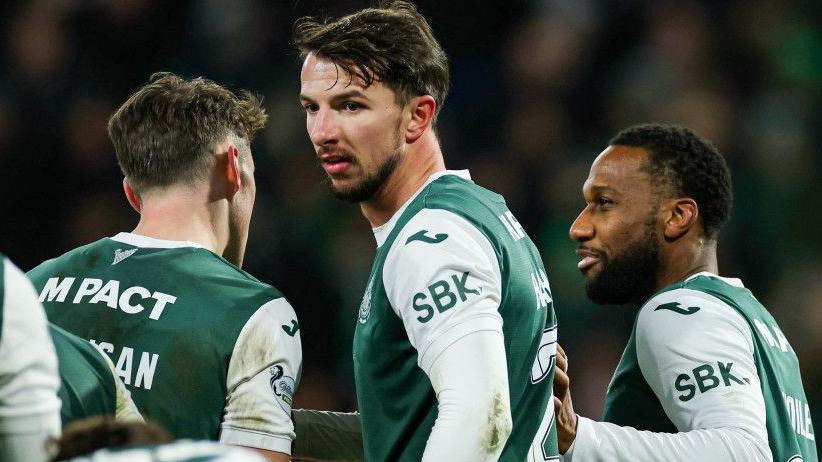 Hibernian's Junior Hoilett (R) celebrates scoring to make it 2-0 with teammates Dan Barlaser during a William Hill Premiership match between Hibernian and Aberdeen at Easter Road