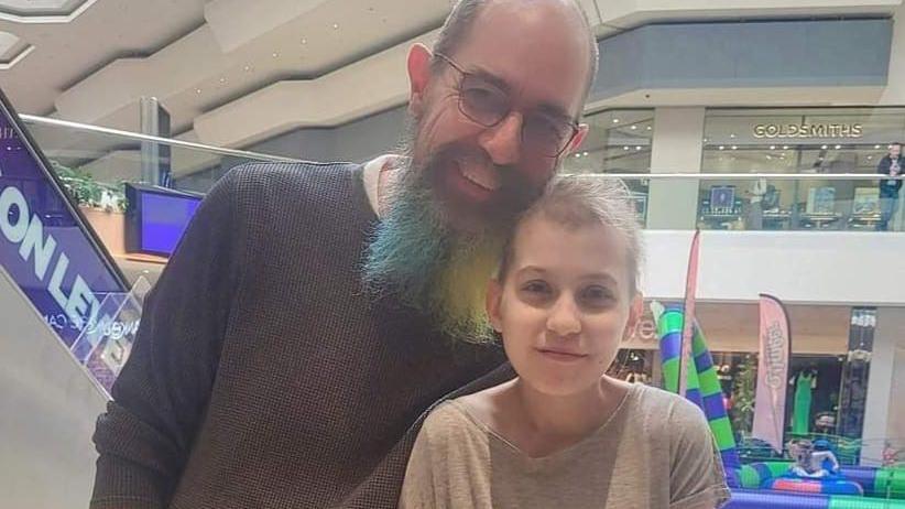 Bethany with her father Martin in a shopping centre 