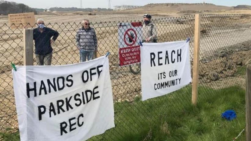 Campaigners at the site with banners against the scheme