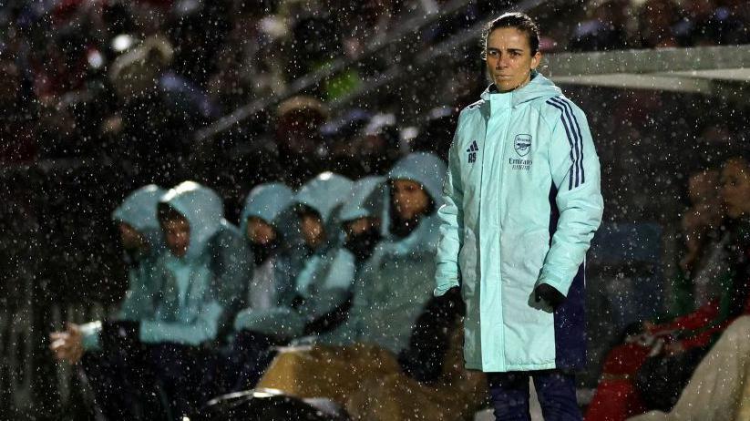 Arsenal boss Renee Slegers watching on a rainy Meadow Park