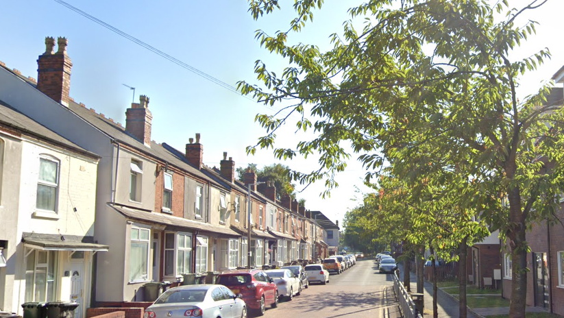 Leicester Street, Wolverhampton, a terraced street with cars parked on the left side of the road and trees lining the right