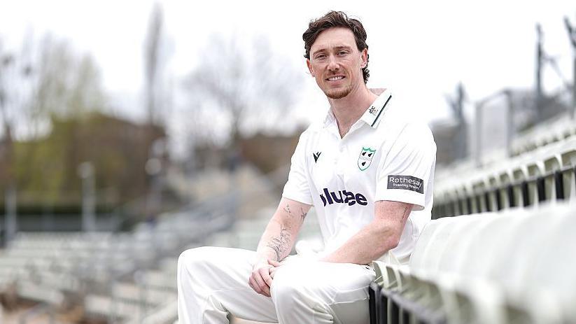 Adam Hose seated at New Road in his white Worcestershire kit