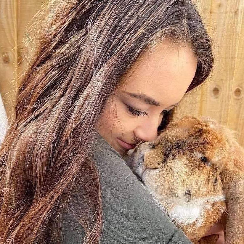 Bethany Hinds snuggling up to one of her rabbits