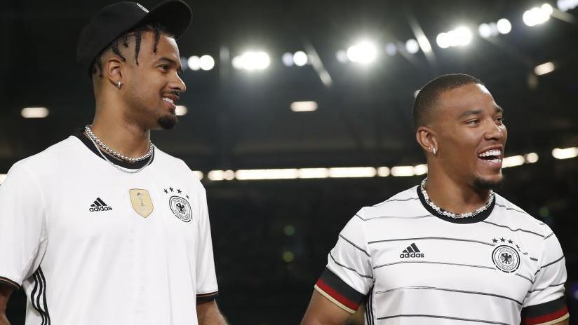 Equanimeous St Brown with his brother Amon-Ra St Brown at an international football friendly between Germany and Colombia in Gelsenkirchen in June 2023