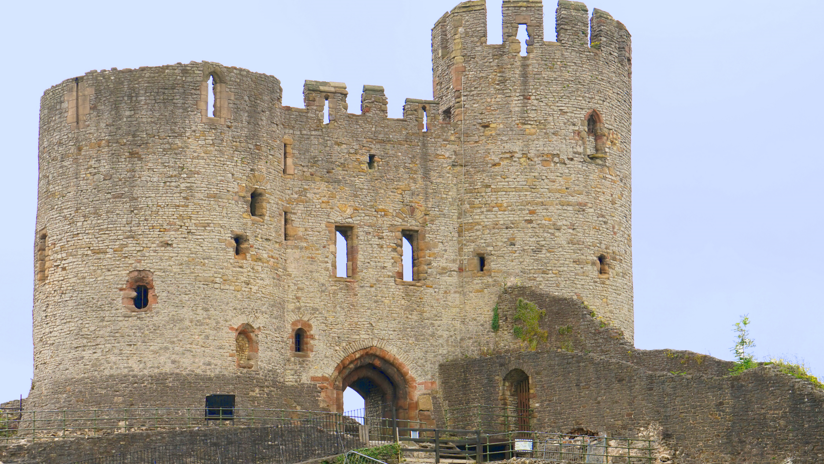 Dudley Castle can be seen in the image with light brown brickwork and an archway