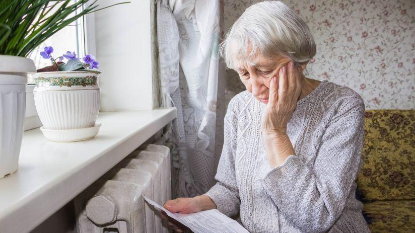 Elderly woman sitting near radiator (file image)