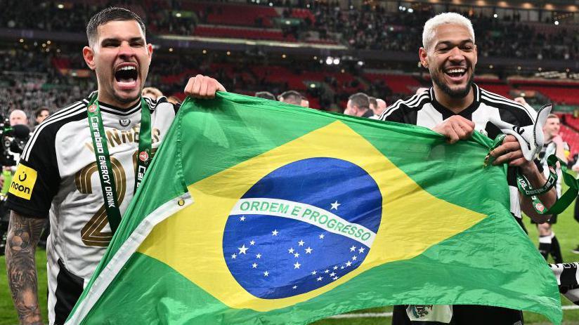 Brazilian pair, Newcastle captain Bruno Guimaraes and Joelinton, fly the flag after the  Carabao Cup triumph against Liverpool