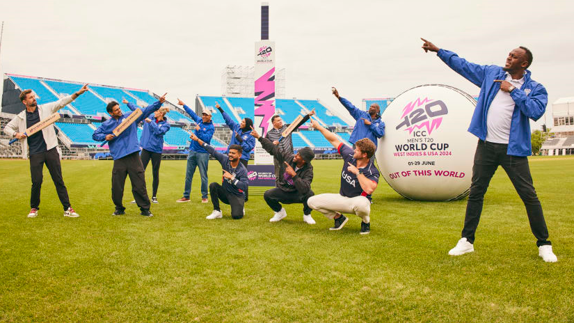 Usain Bolt does his trademark point at the stadium in Eisenhower Park, New York