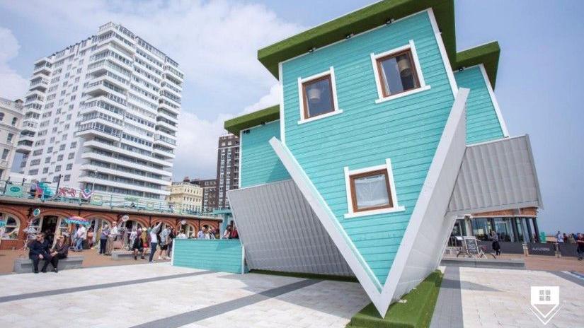 Image of what the 'upside down' house installation could look like on Blackpool's South Pier.