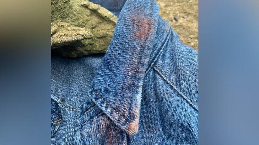 Red dust that has been placed on an outfit from the Toxic Town show