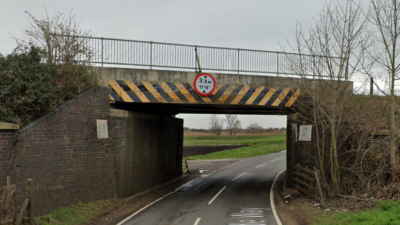 Street view image of the railway bridge going over Queen Adelaide Way road.