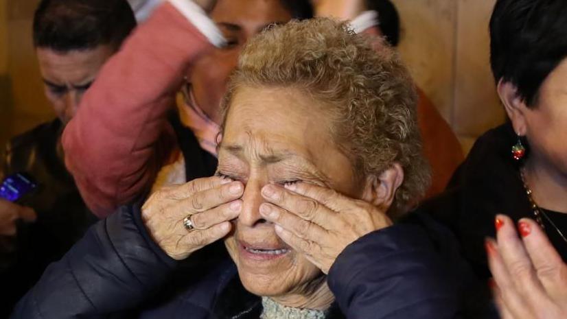 A supporter of former Peruvian President Alberto Fujimori cries after learning of his death outside his residence in Lima, Peru, 11 September 2024. Fujimori died at his residence at the age of 86, after "a long battle with cancer," confirmed his daughter and political heir Keiko Fujimori.