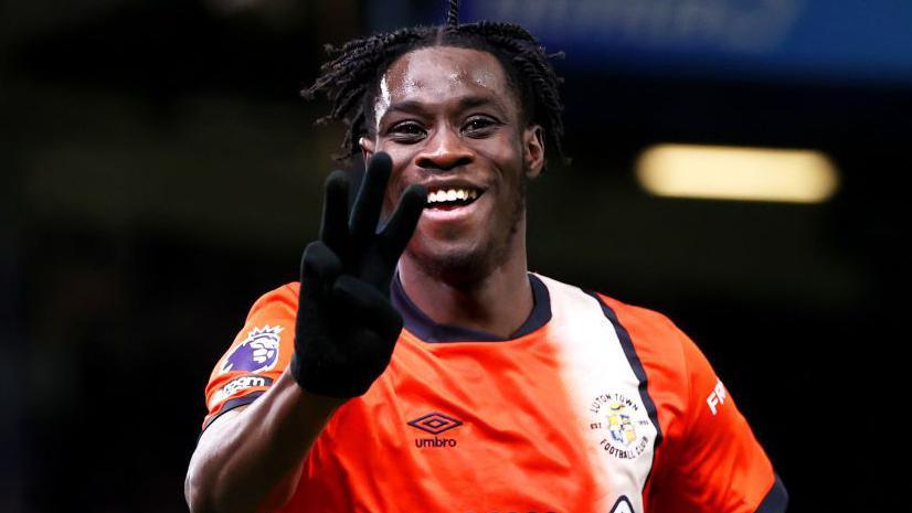 Elijah Adebayo celebrates his third goal in Luton's Premier League victory at home to Brighton